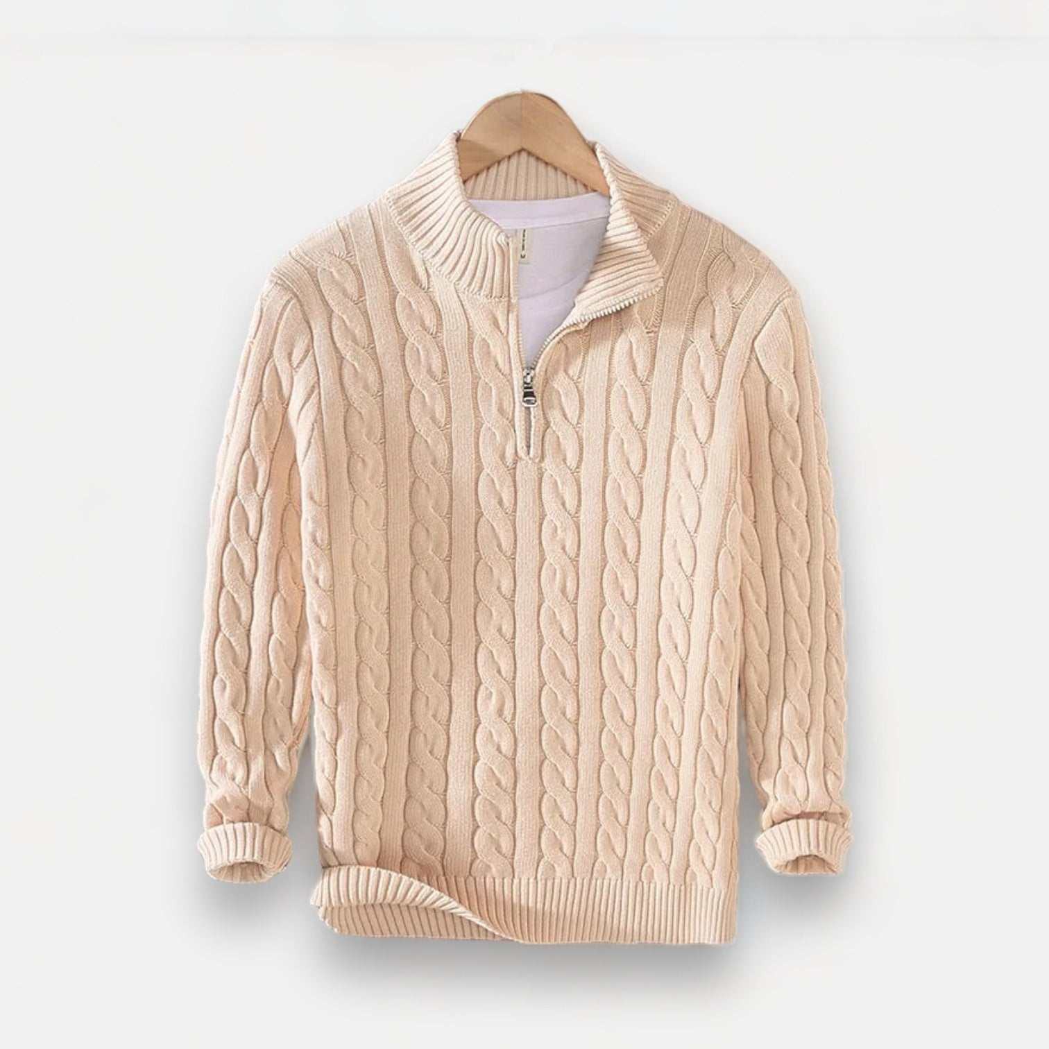 Autumn half zipper braided cotton sweater in cream color on hanger.