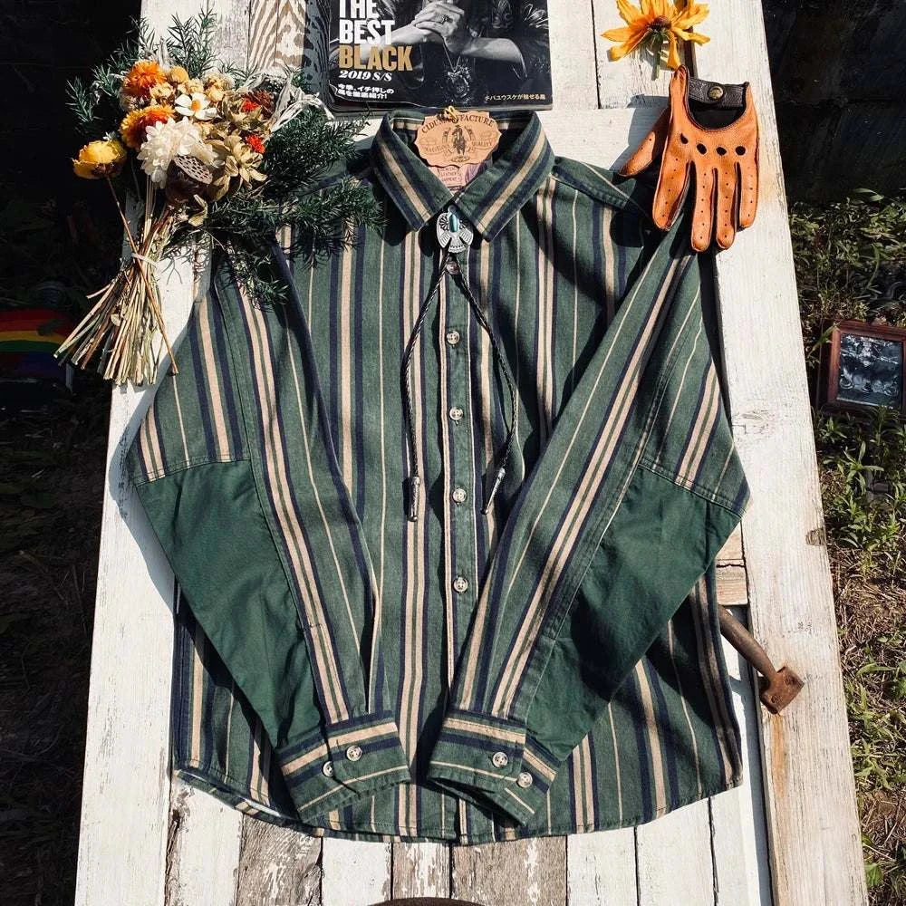 Vintage summer cotton shirt with stripes on rustic table with accessories.