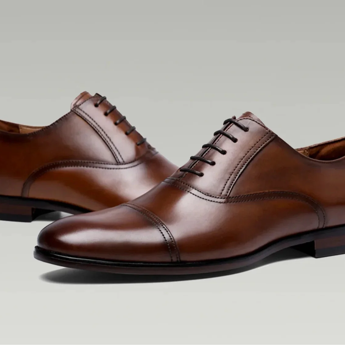 Brown formal British business shoes made of genuine leather, ideal for men seeking professional style.