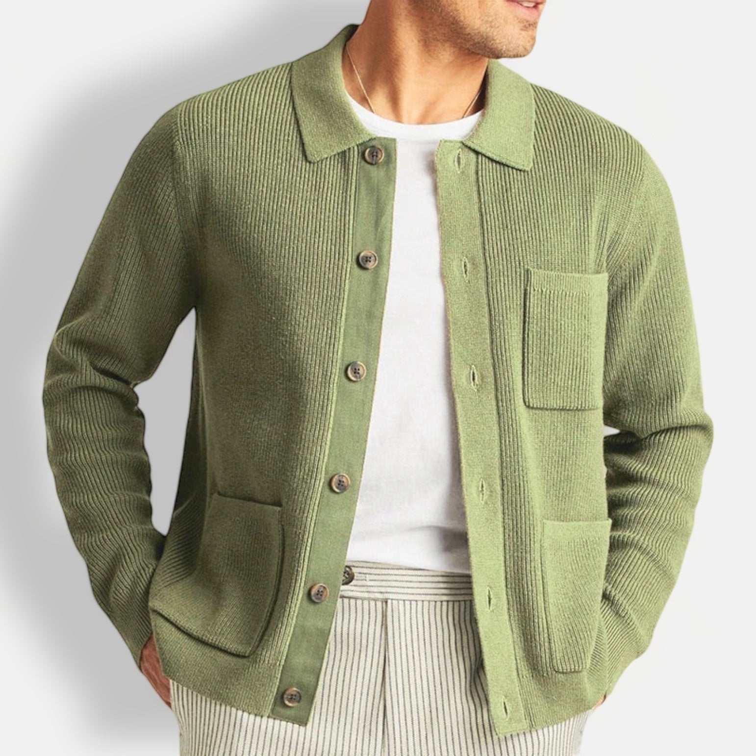 Men's fall vintage cardigan in green with button-up front and pockets.