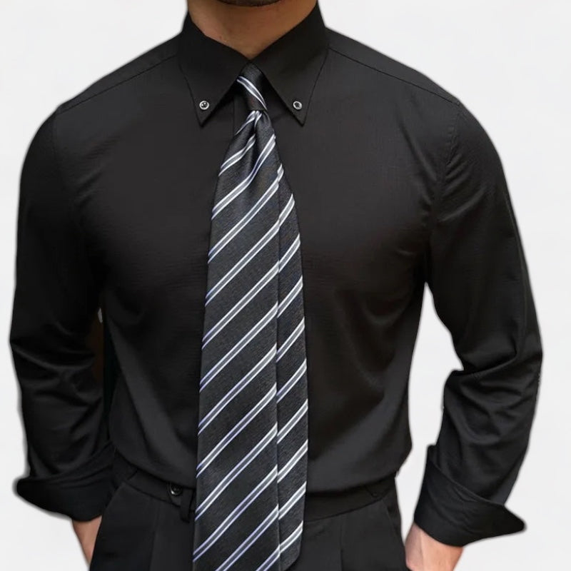 Antonios Oxford Shirt in black with long sleeves and striped tie.