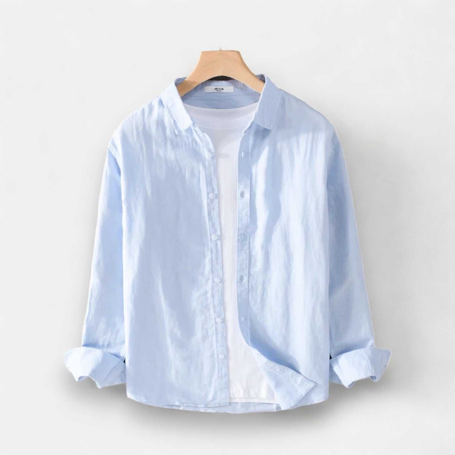 Men's summer casual long-sleeve shirt in light blue, breathable linen and cotton fabric.