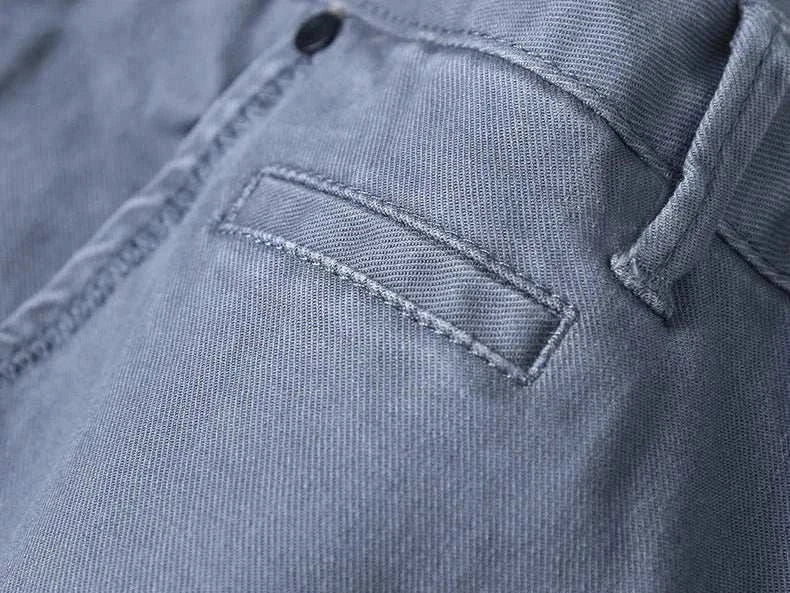 Close-up of cotton straight chino pants with pocket detail.
