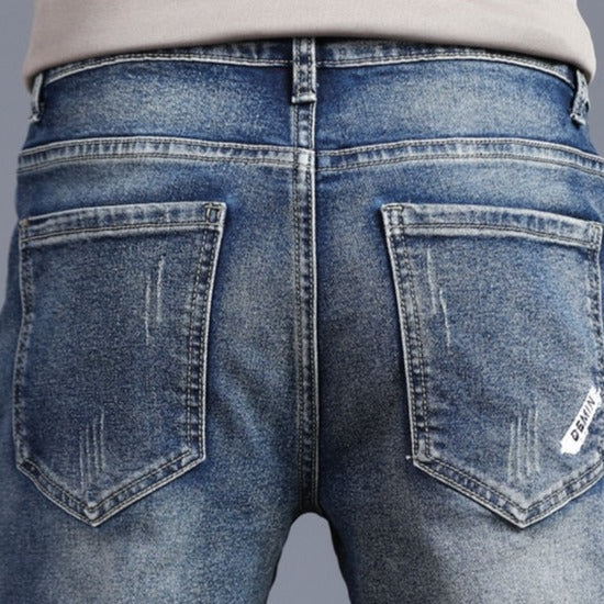 Back view of Vinny Denim Jeans showcasing classic pocket stitching and casual style.