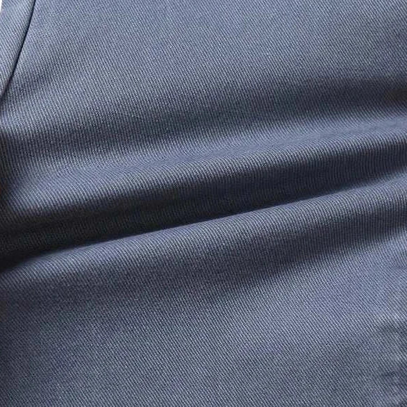 Cotton straight chino pants fabric showing stretch and texture.