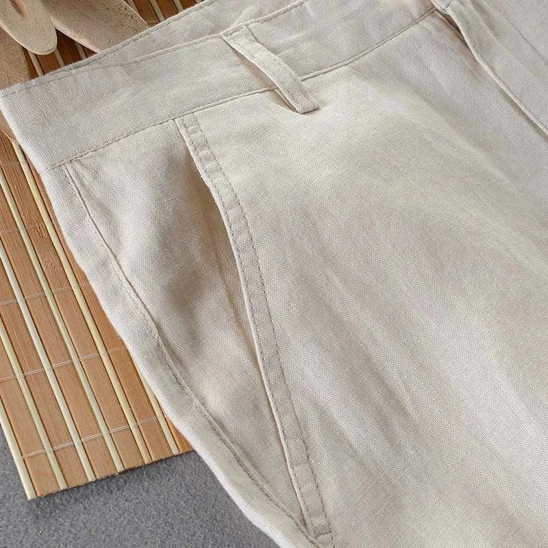 Linen casual pants on a bamboo mat, showcasing breathable and comfortable fabric.