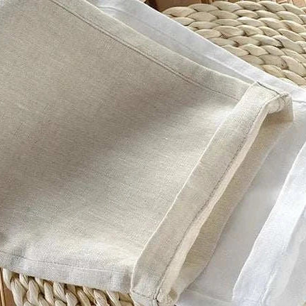 Linen casual pants on a woven basket background.