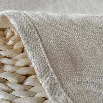 Beige linen fabric close-up, ideal for casual pants.