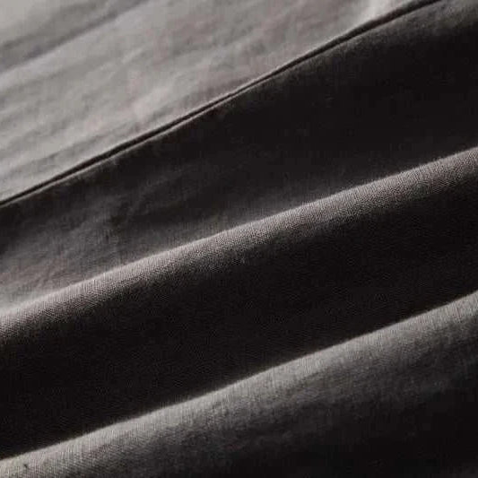 Close-up of Italian design linen pants fabric, showcasing breathable and lightweight 100% linen material.