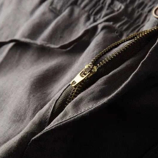 Close-up of Italian design linen pants showcasing a zipper detail, made of 100% linen.