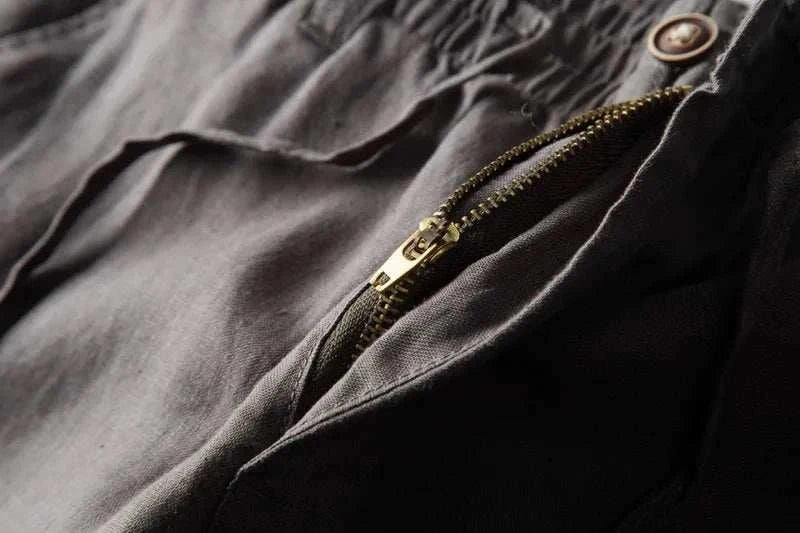 Close-up of Italian design linen pants showcasing a zipper detail, made of 100% linen.