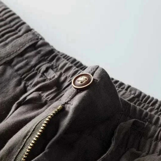 Italian design linen pants with button and zipper detail.