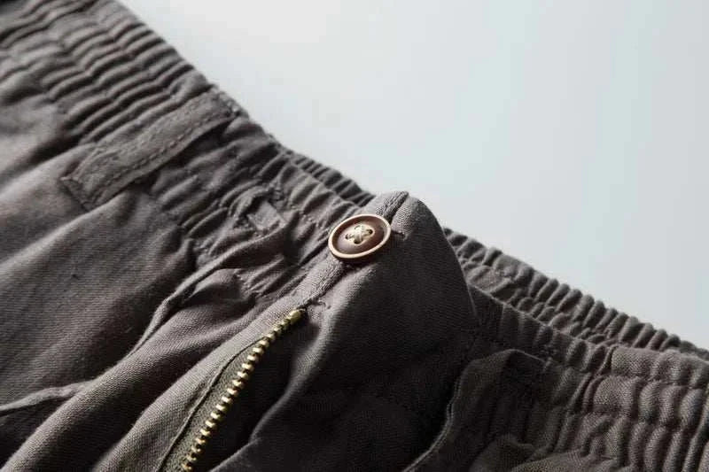 Italian design linen pants with button and zipper detail.