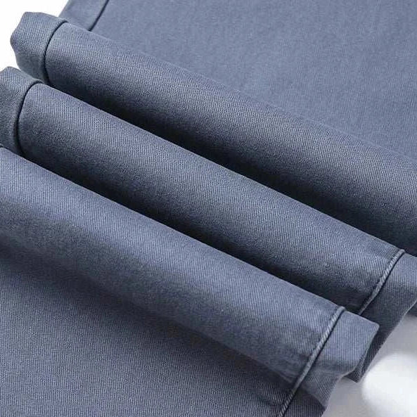Cotton straight chino pants, casual and comfortable, folded fabric close-up.