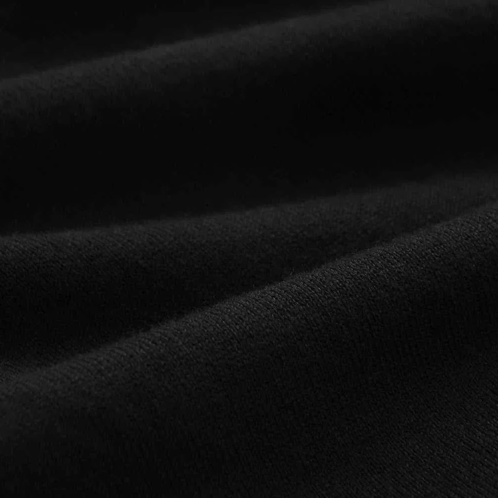 Close-up of black cotton fabric used in the Old Money American polo t-shirt, showcasing its texture.