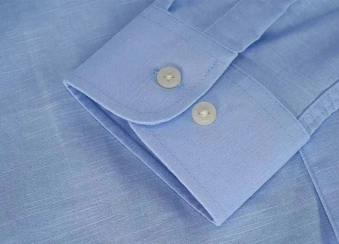 Blue cuff of Antonios cotton-linen long sleeve shirt showing button detail and fabric texture.