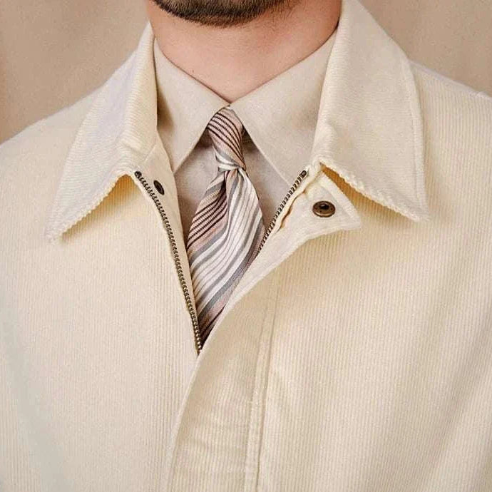 Pure cotton bomber jacket in cream, featuring a collar and zip-up front.