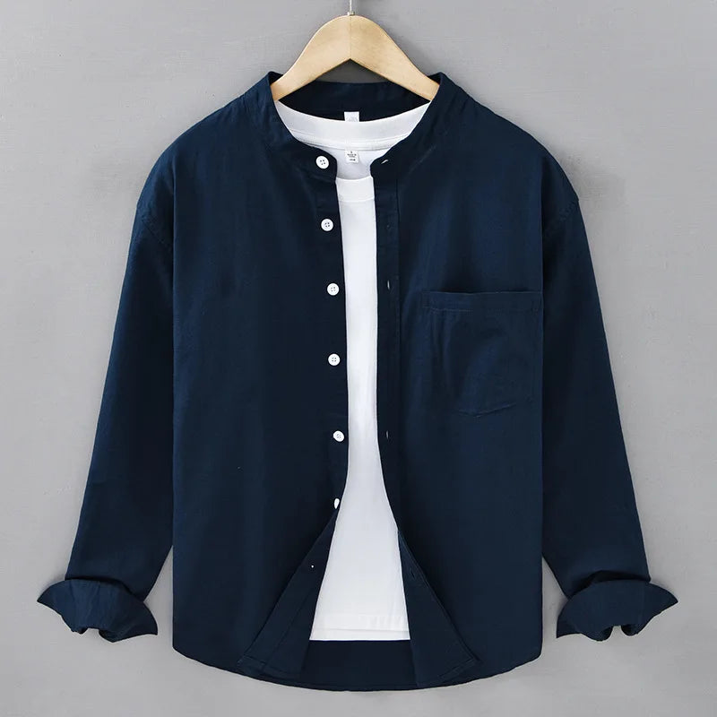 Mandarin collar retro casual Japanese style cotton linen shirt hanging on a wooden hanger.