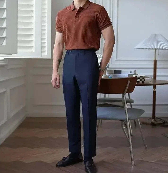 LUXELY vintage t-shirt in striped design, paired with high-waisted trousers, in a stylish indoor setting.