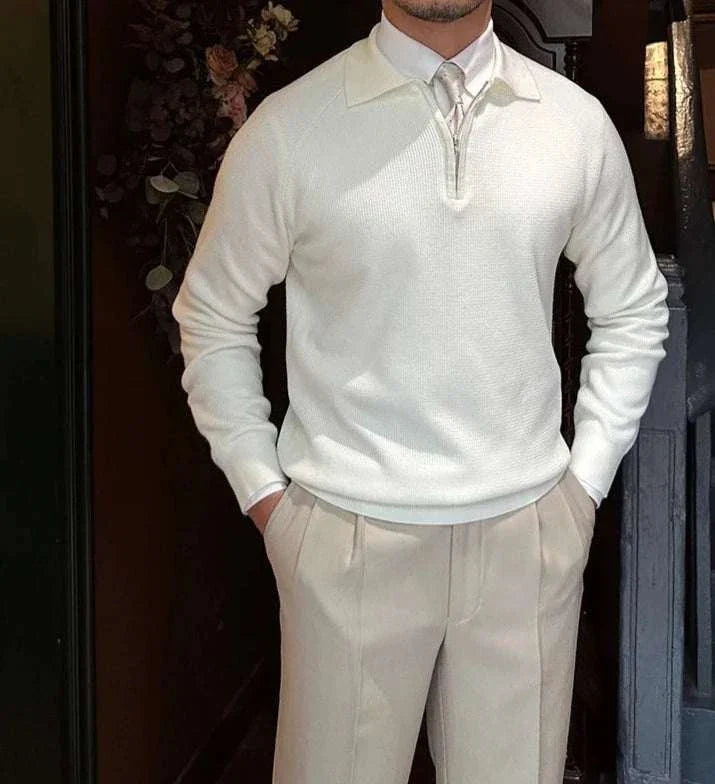 White Oxford zipper sweater for men styled casually with beige pants.
