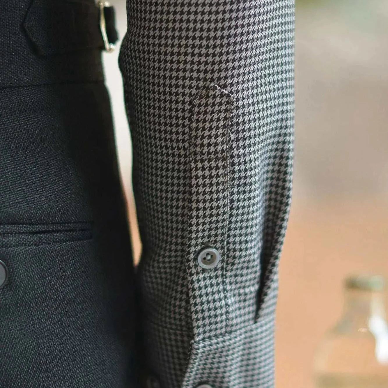 Office tuxedo long-sleeve shirt close-up with elegant button details.
