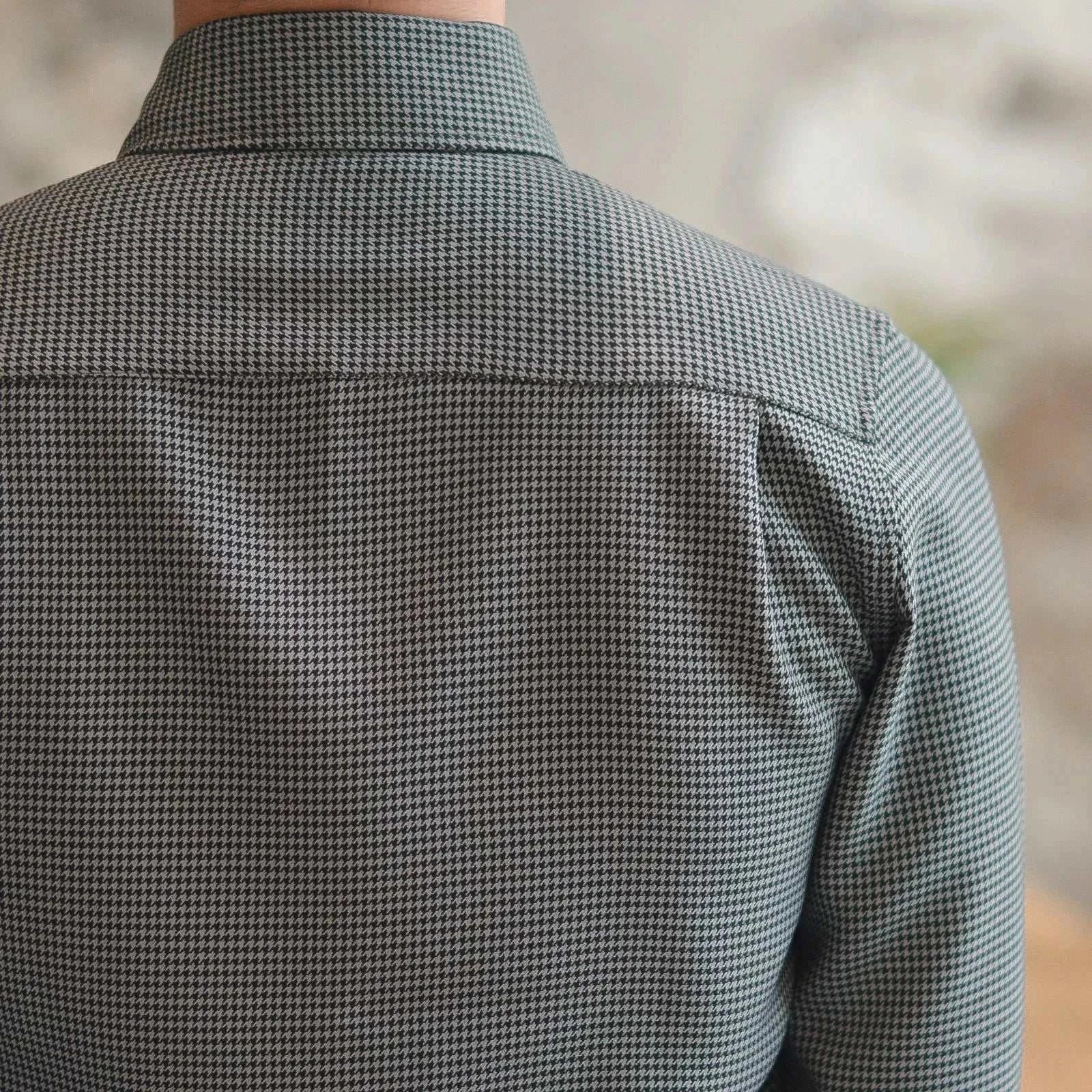 Back view of a stylish office tuxedo long-sleeve shirt in a check pattern.