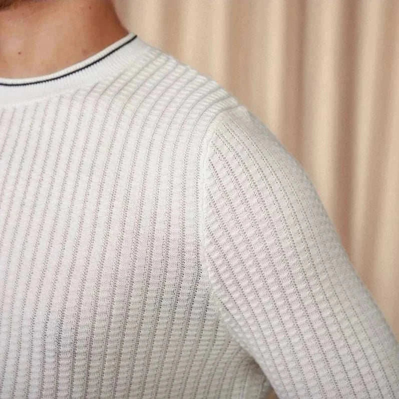 Men's winter wool sweater in white ribbed design for warmth and style.