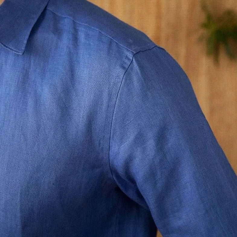 Men's relaxed fit long sleeve linen shirt in solid blue, perfect for casual and office wear.
