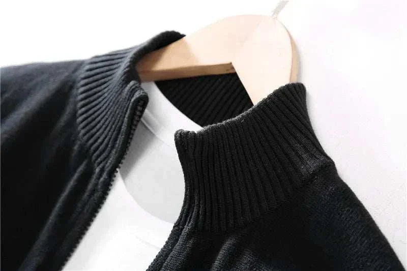 Close-up of black Cold Season Casual Cardigan on hanger, showing ribbed collar detail.