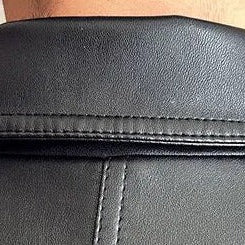 MOTO black leather jacket eco-friendly close-up of collar.