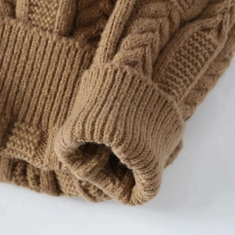 Juku winter sweater in premium wool material, khaki color, close-up of fabric texture.