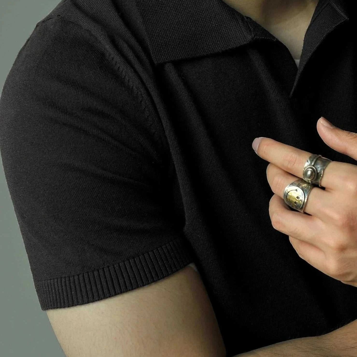 Old money American polo t-shirt in solid black, showcasing casual elegance.