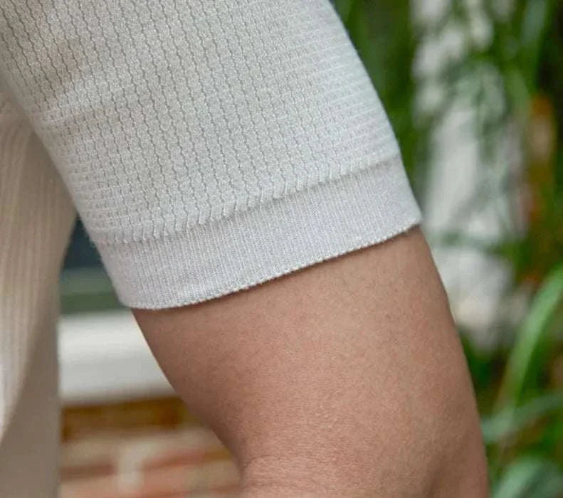 Close-up of short sleeves on a white summer v-neck polo English t-shirt.