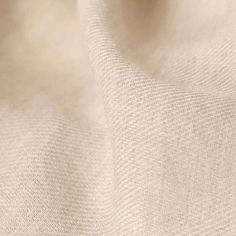 Close-up of beige cotton fabric texture from Antonios one-piece collar cotton shirt.