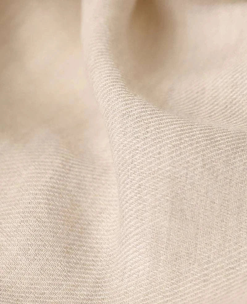 Close-up of beige cotton fabric texture from Antonios one-piece collar cotton shirt.