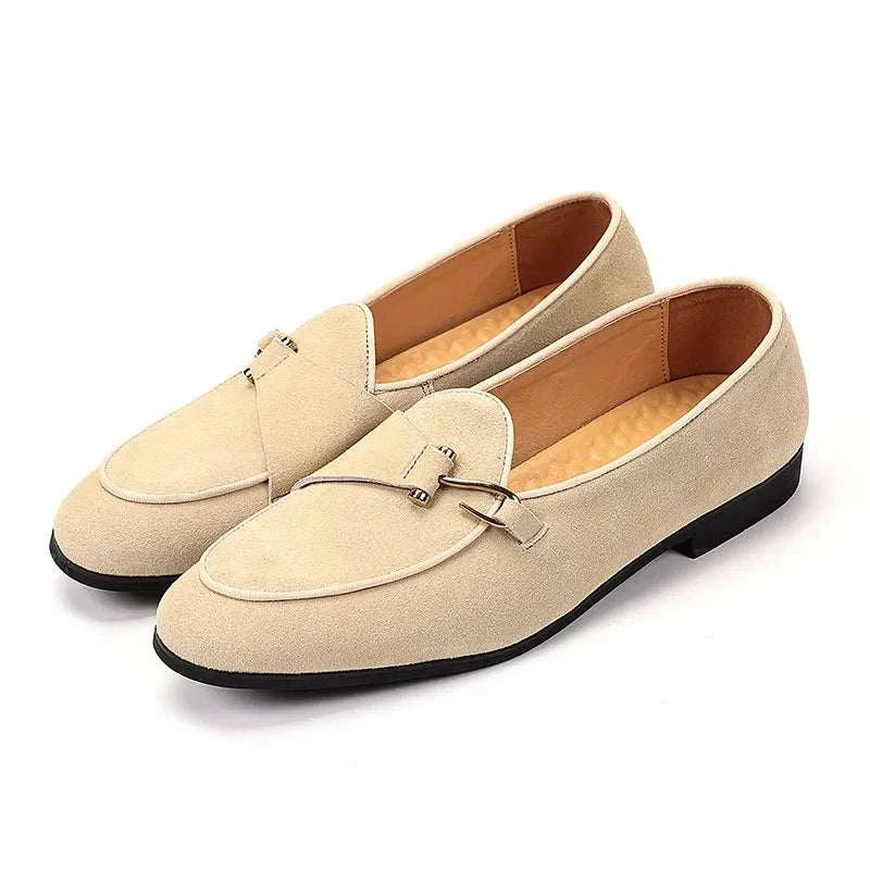 Elegant suede leather loafers in beige, featuring intricate perforations and cushioned insoles for men's comfort and style.