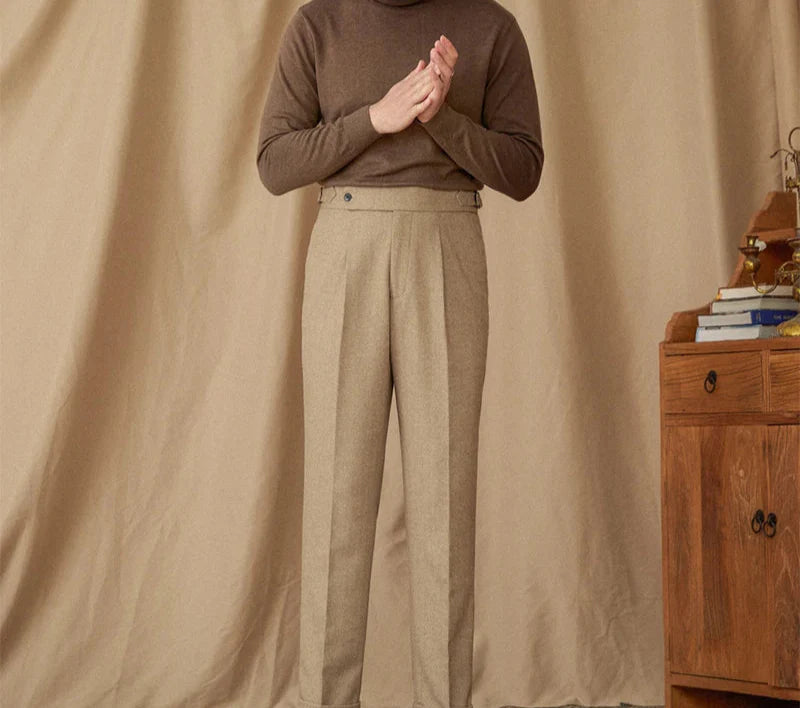 Wool winter Italian trousers in beige, worn by a standing man.