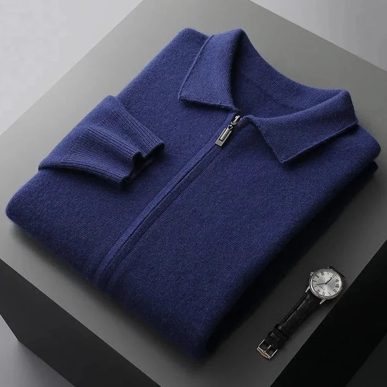 Blue Antonios Cashmere Cardigan folded with a silver watch nearby on a dark surface.
