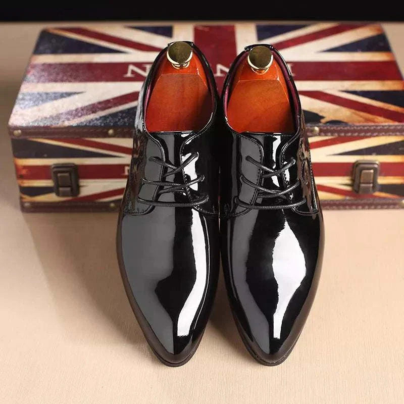 Brogue elegant shoes in black on display with Union Jack background.