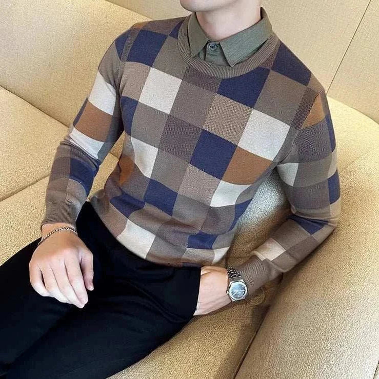 Tone two color sweater in check pattern on a man sitting on a sofa.