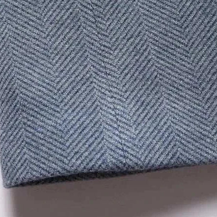 Business casual Korean coat fabric detail in herringbone pattern, polyester-wool blend.