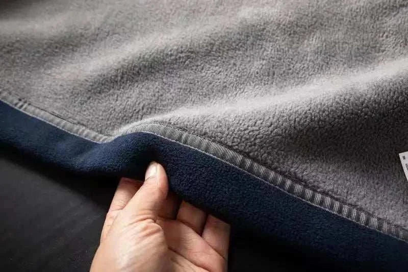 Close-up of Norway puffer jacket fabric, showcasing its soft and warm texture.