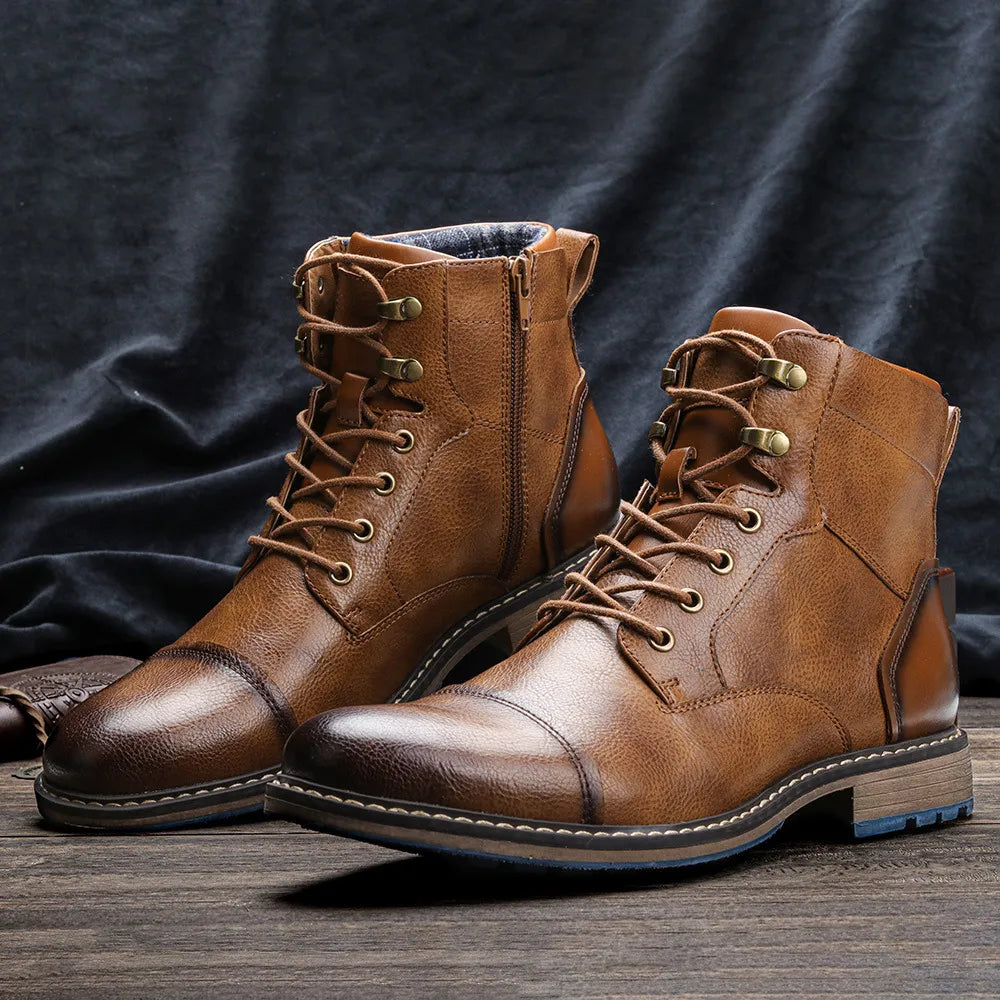 Brown ANT ankle boots with classic minimalist design on wooden surface.