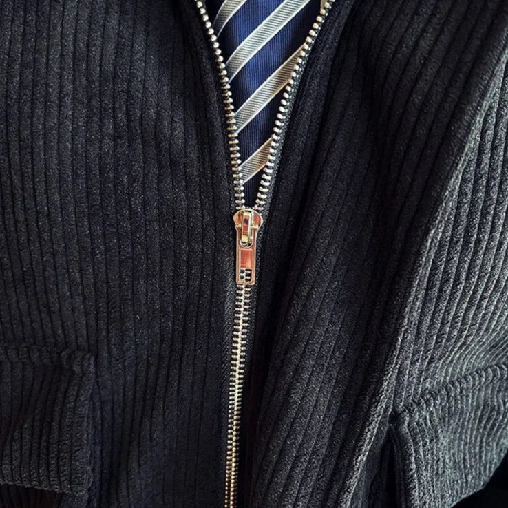 Corduroy casual jacket with zip detail, blue and gold accent-striped shirt underneath.