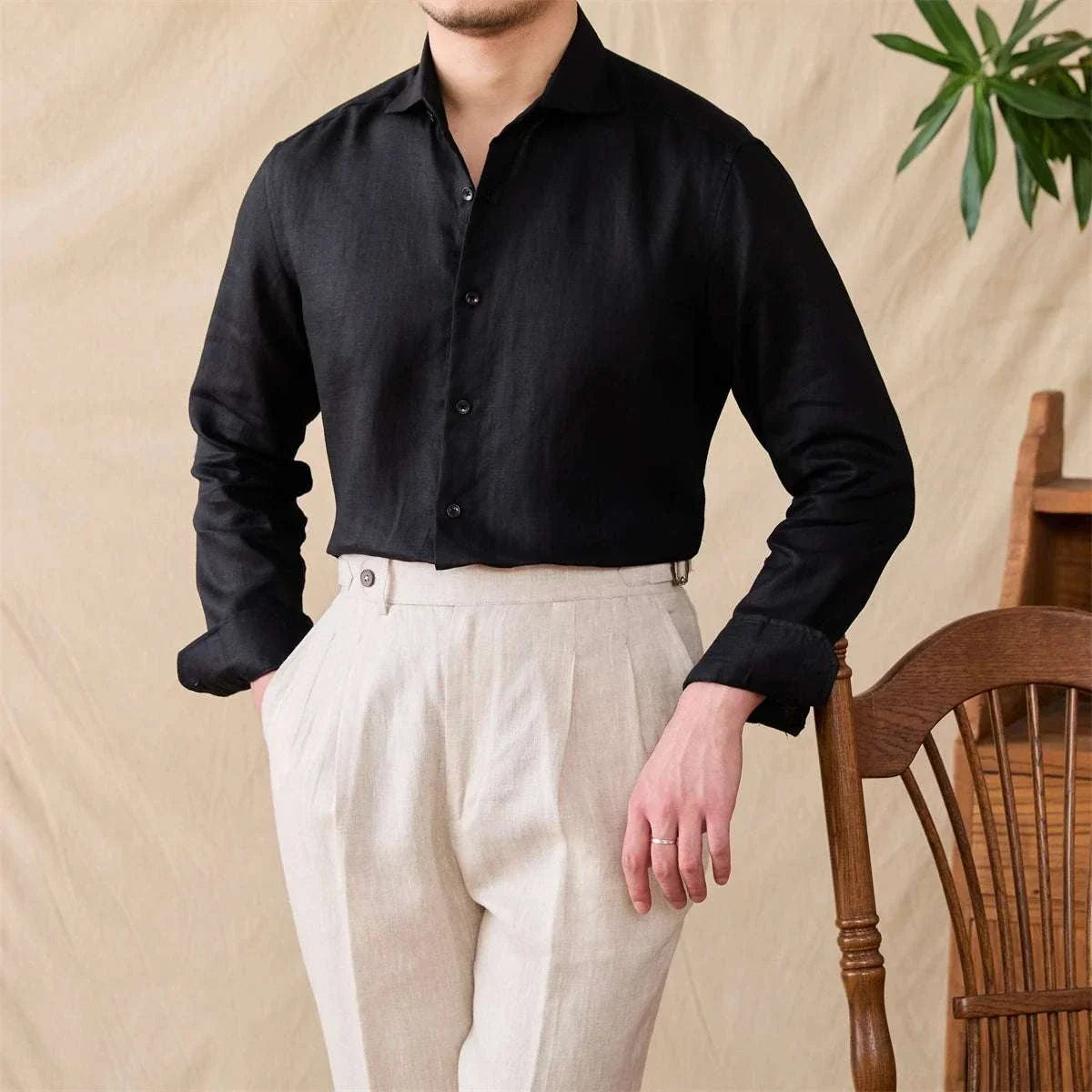 Men's black lightweight linen long-sleeve shirt, perfect for warm weather.