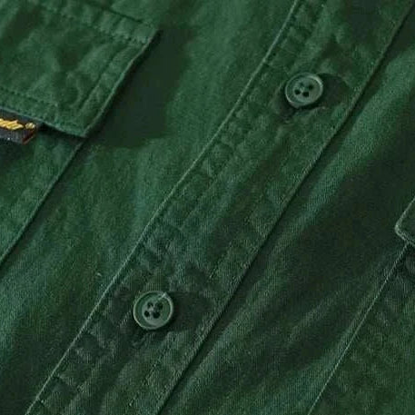 Pure cotton casual spring shirt in solid dark green fabric with button details.