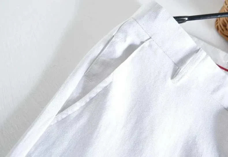 Linen straight oversize trousers in white, perfect for smart casual style.