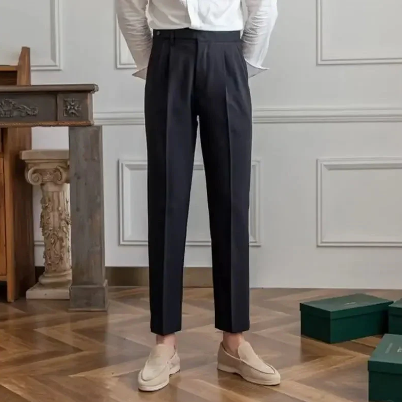 Antonios draped suit pants showcasing Korean-inspired elegance in a stylish setting.