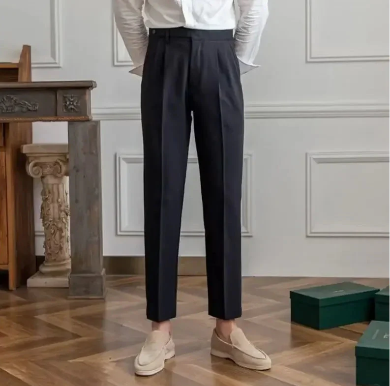 Antonios draped suit pants showcasing Korean-inspired elegance in a stylish setting.
