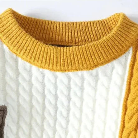 Norway neck sweater with elegant cable knit design in solid colors.
